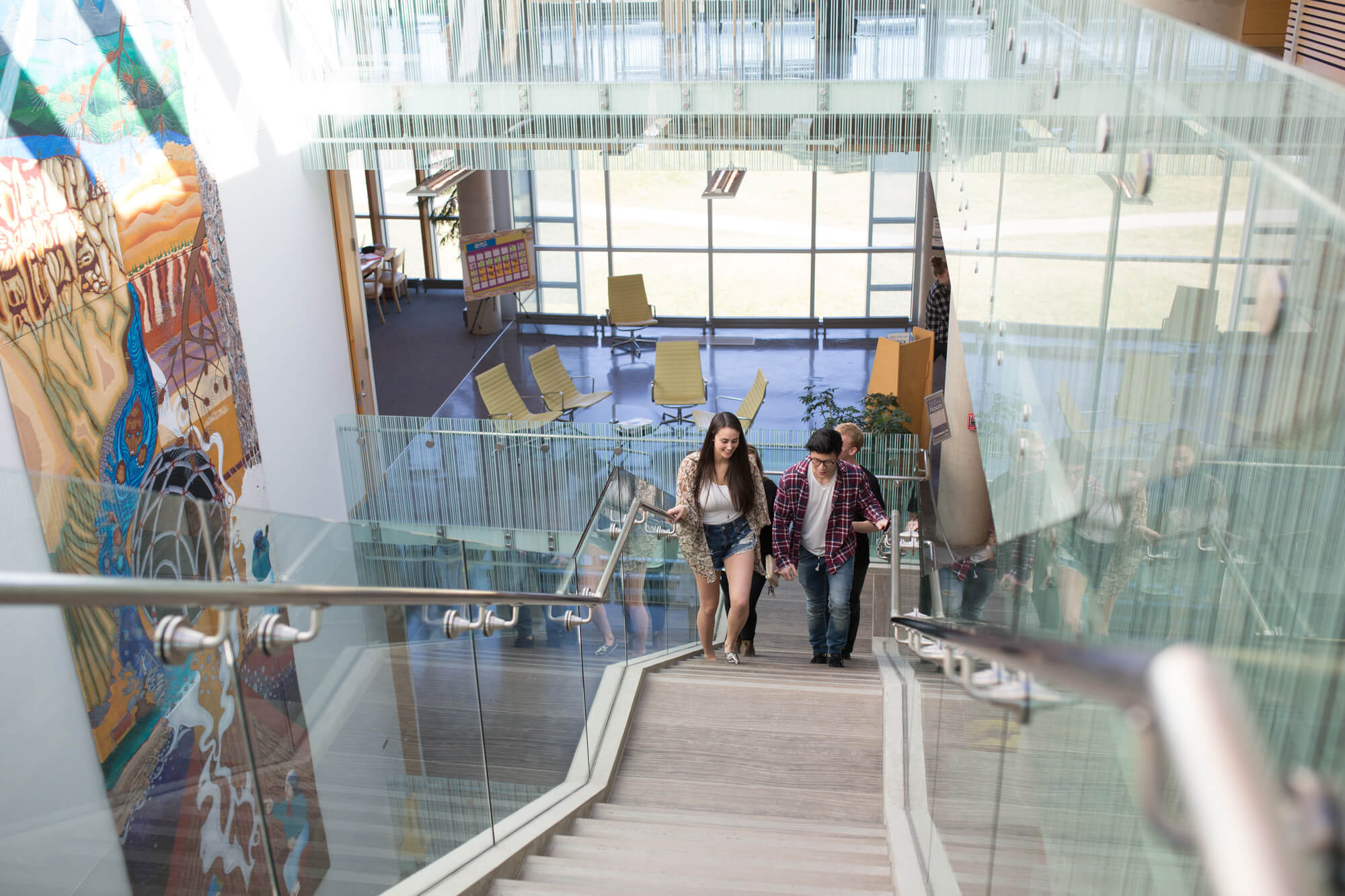 Students walking up stair case on campus